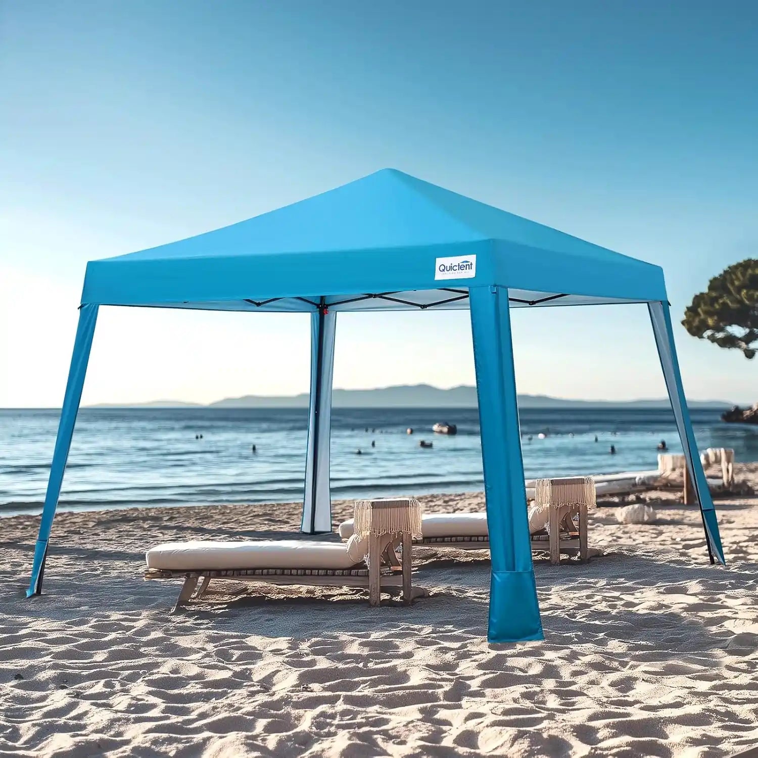 Blue pop-up canopy tent on a sandy beach#style_Blue