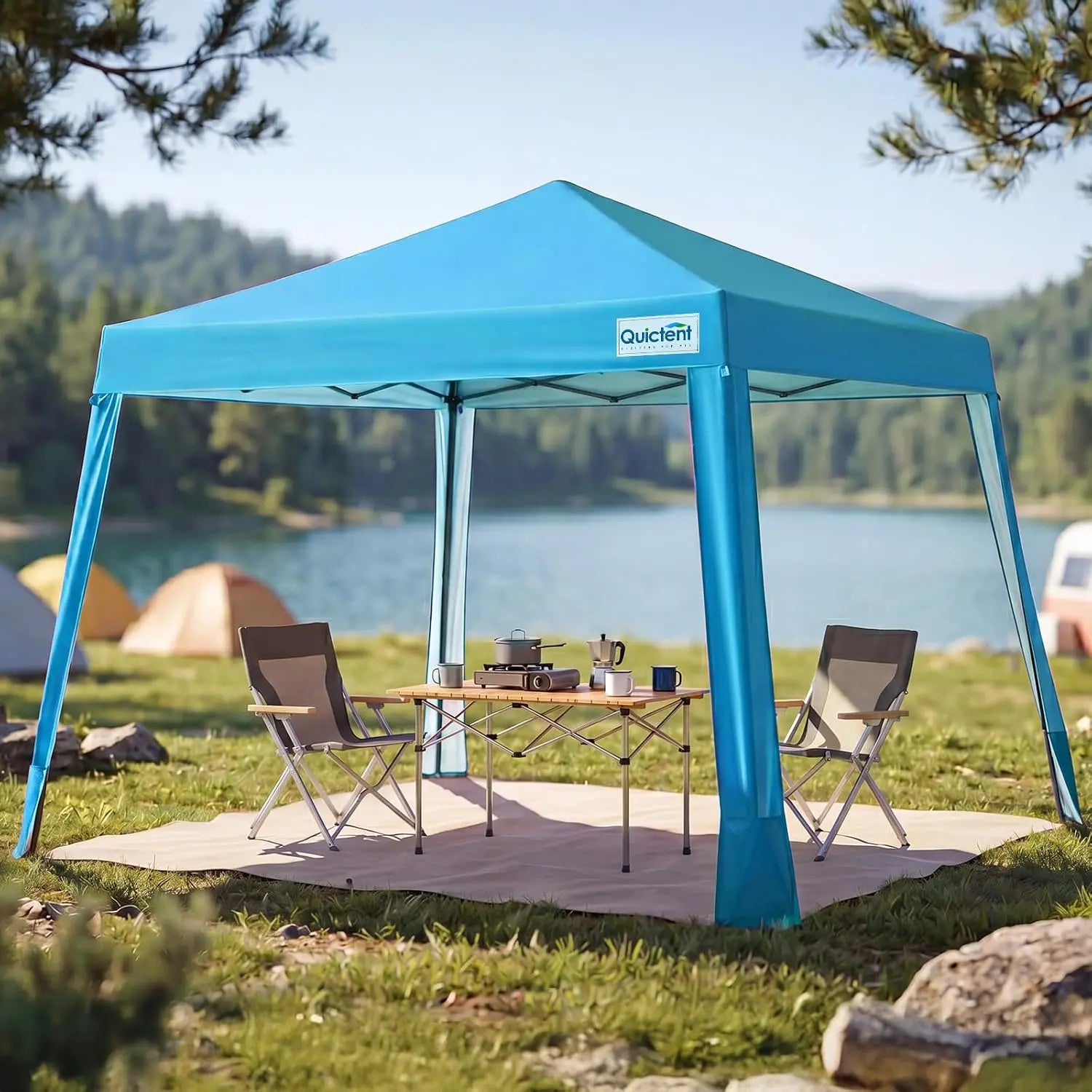 Blue pop-up canopy tent on a sandy beach#style_Blue