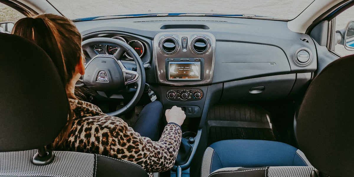 Woman-driving-modern-car-along